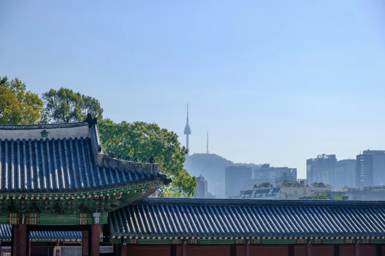 a building with a tower next to buildings