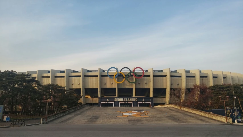 a large building with olympic rings painted on the front