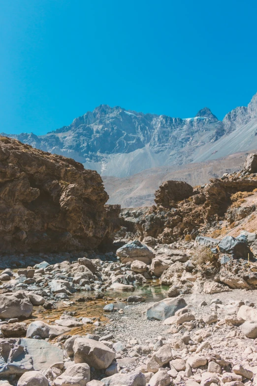 the rocky area that the man is hiking up