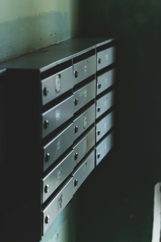 an industrial steel drawer is sitting on the wall