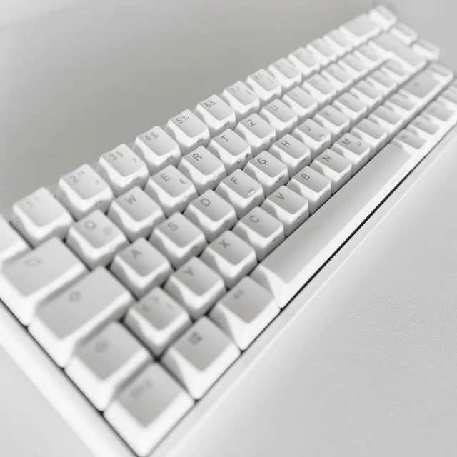 an angled view of a white computer keyboard