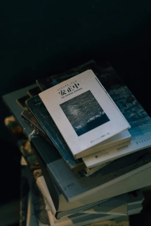 a stack of books with a black cover