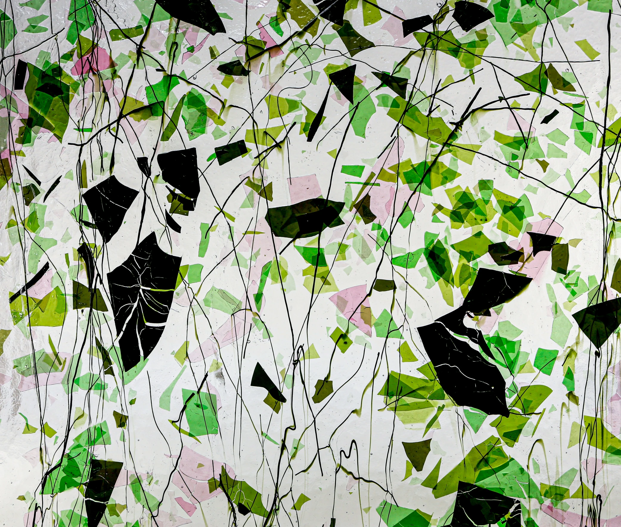 a large abstract painting with leaves on a wall