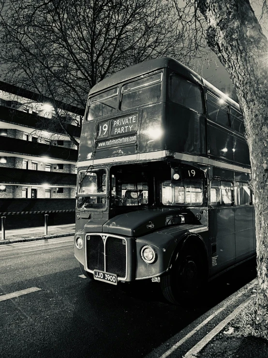 a double decker bus driving down a road