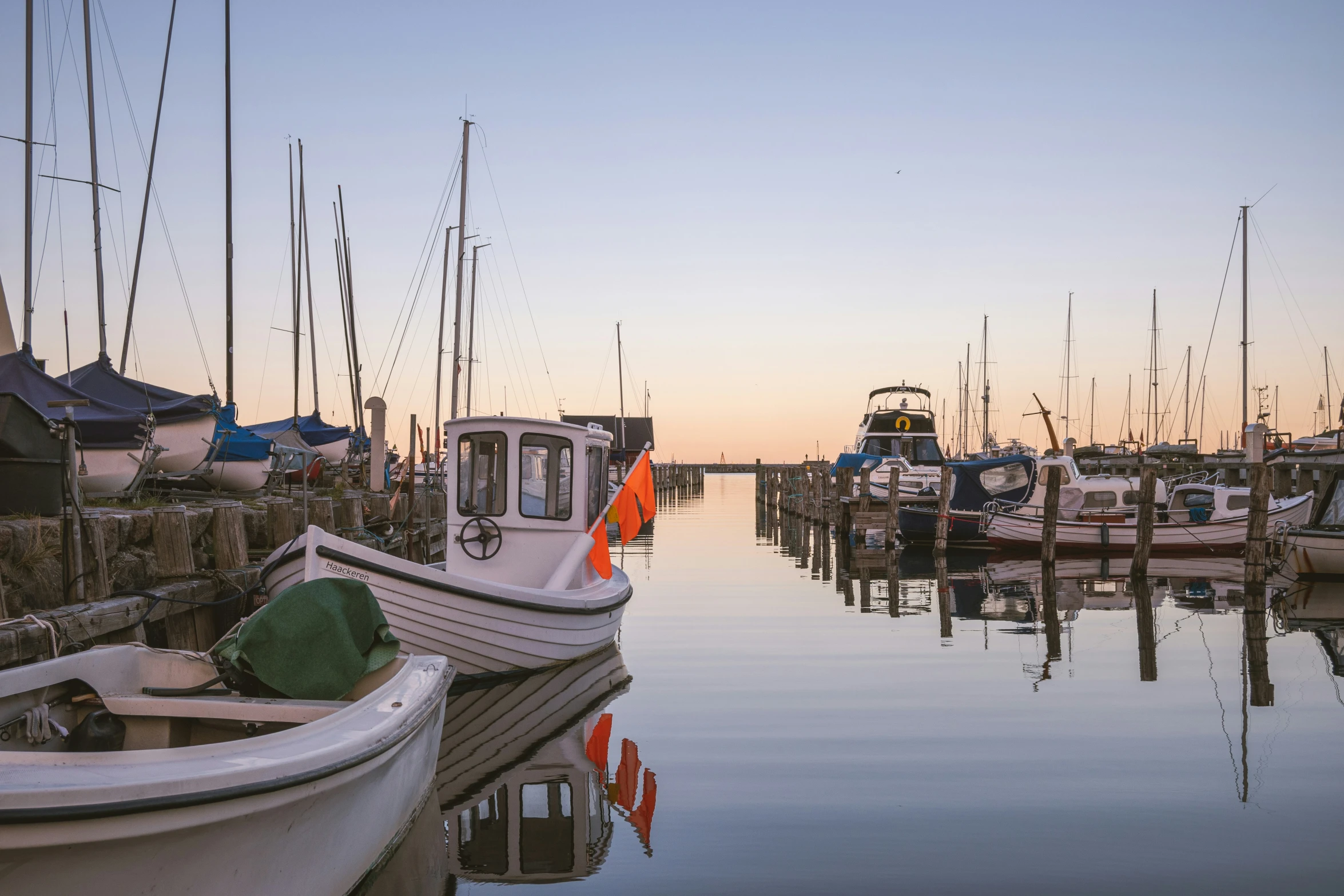 small boat parked at the end of a dock