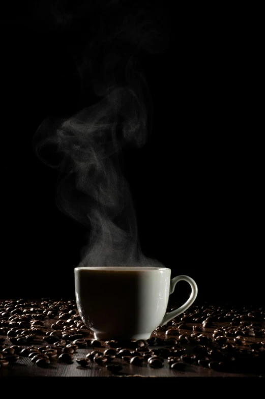 cup of coffee with steam rising out of it