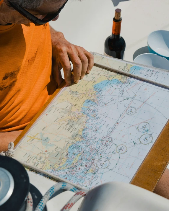 the man has a map of the world on the beach