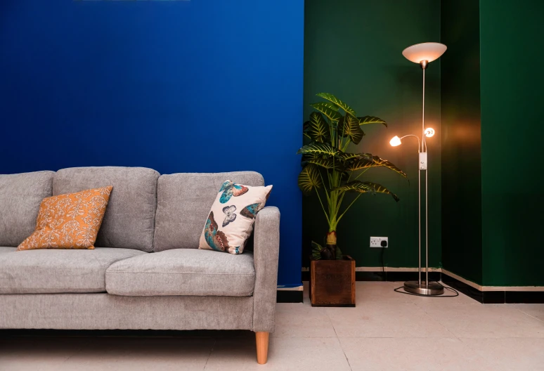 two different living rooms have bright blue walls