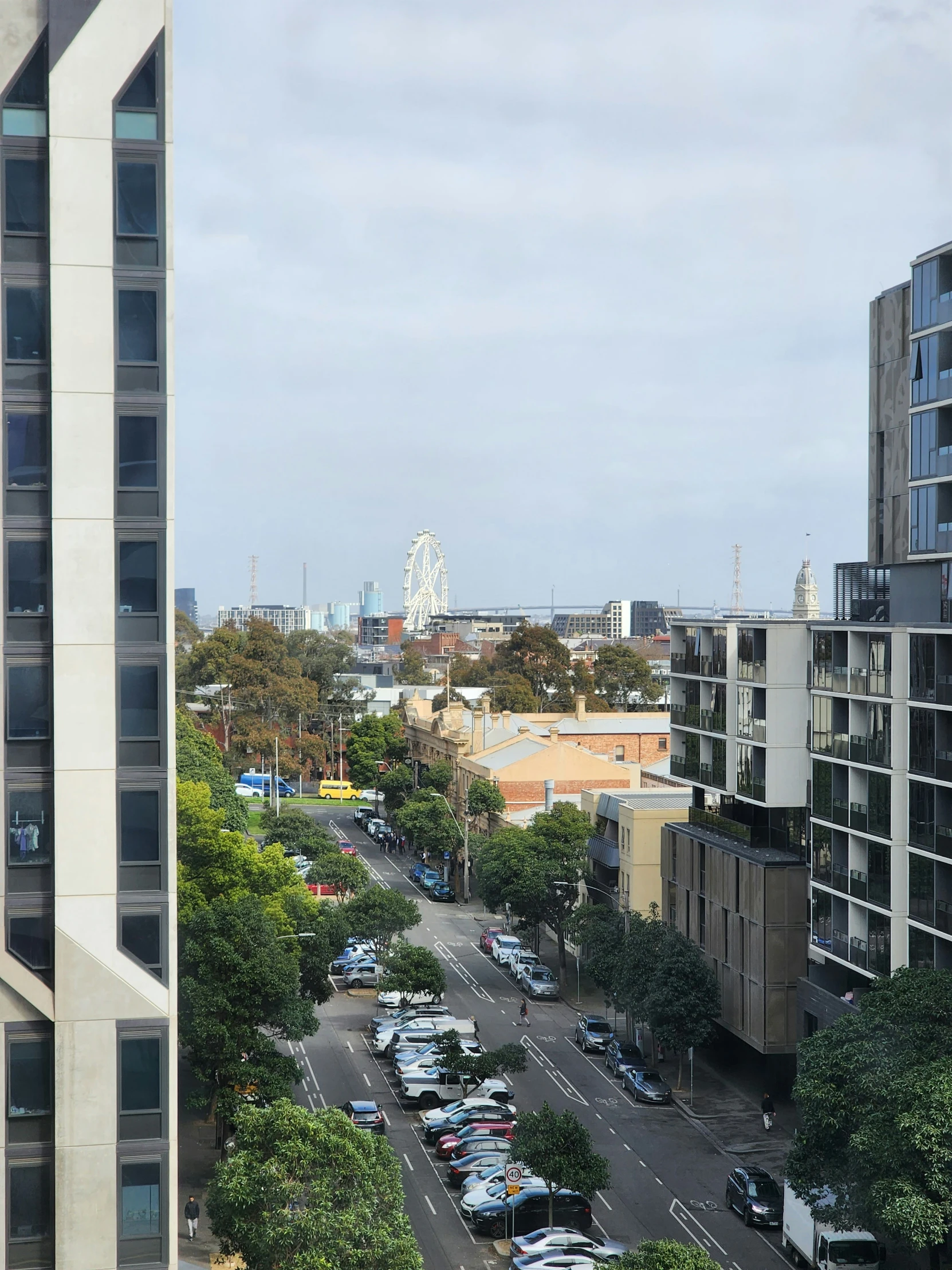 the parking lot in front of some buildings in the distance