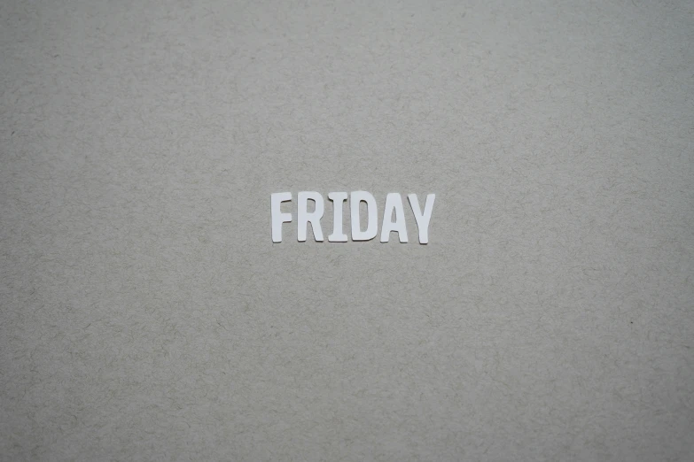 the word friday written on the wall is white