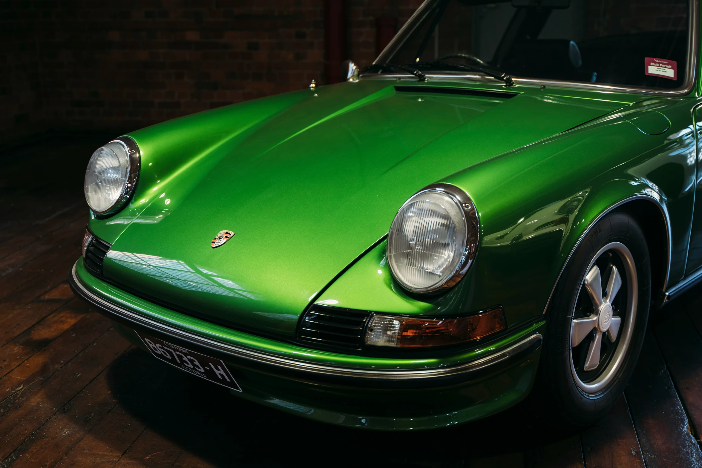 a green car is sitting on a table