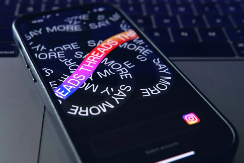 the message message on a black cellphone is displayed in close up