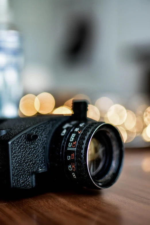 a camera sitting on top of a wooden table