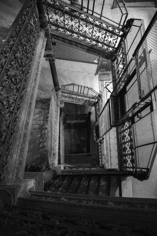 black and white pograph of some stairs leading to a door