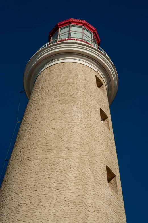 a close up image of a white building with a light tower