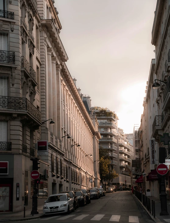 some buildings and cars are on the street