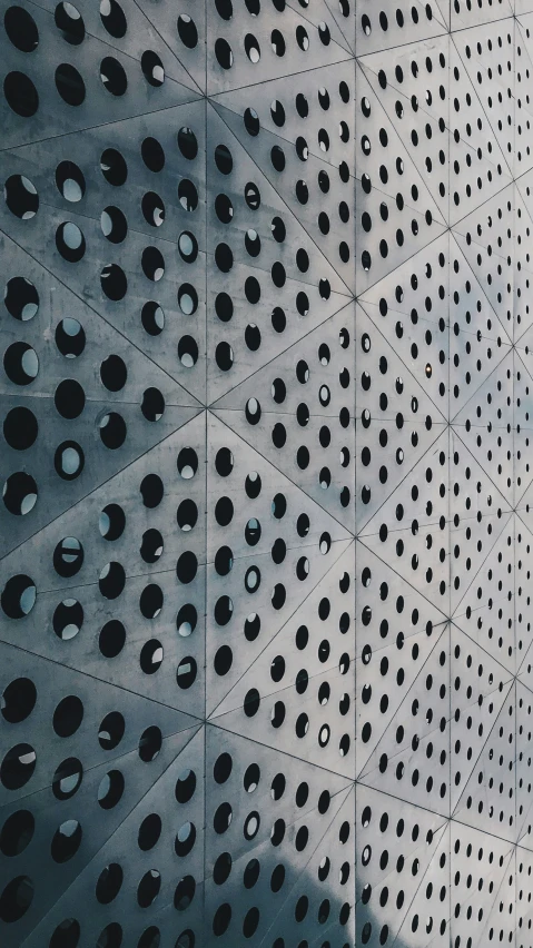 a wall with holes and circles on it