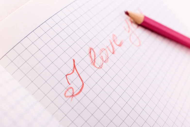 a pencil drawing the word love on paper