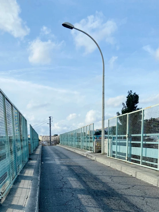 an empty city street with a traffic light