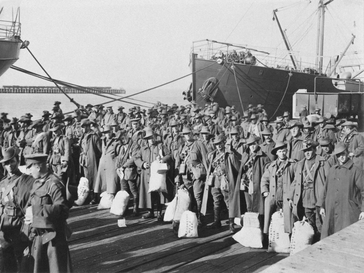 some military men are gathered on the dock