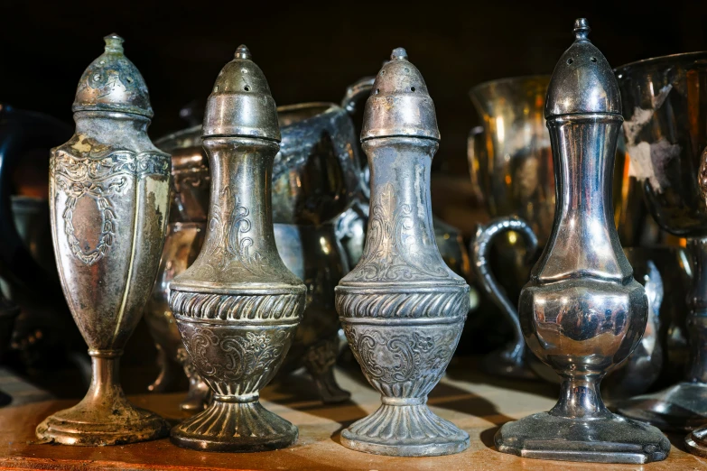 a bunch of vases and bowls sitting on top of a table