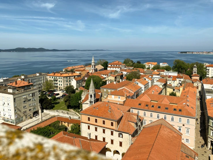 red rooftops of a small city by the ocean