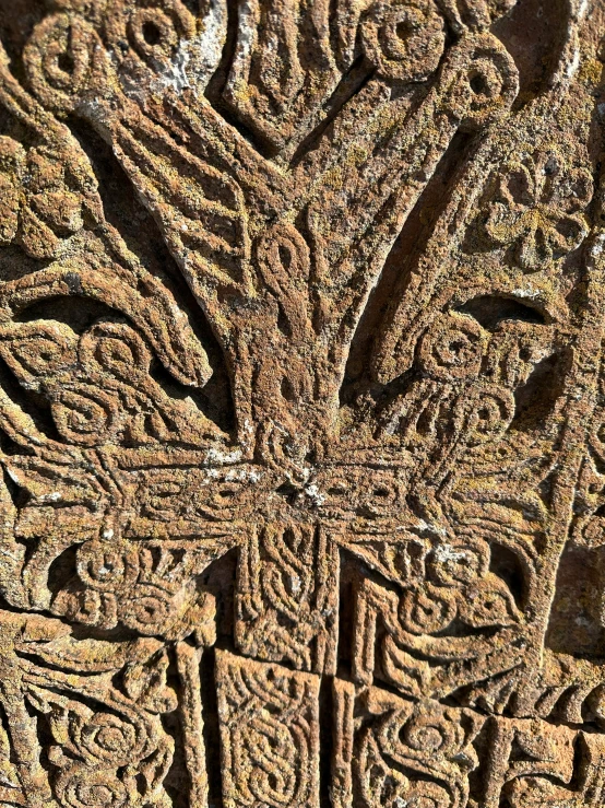 the intricate carvings in the rock at the ruins