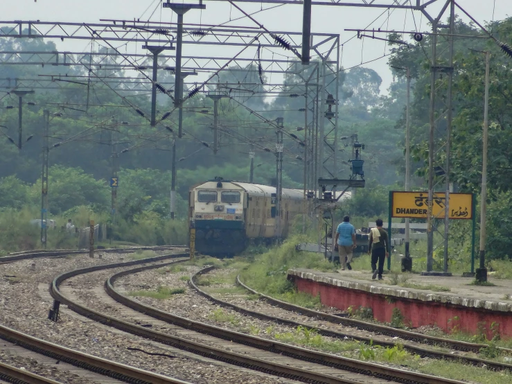 there is a train that is passing on the railroad track