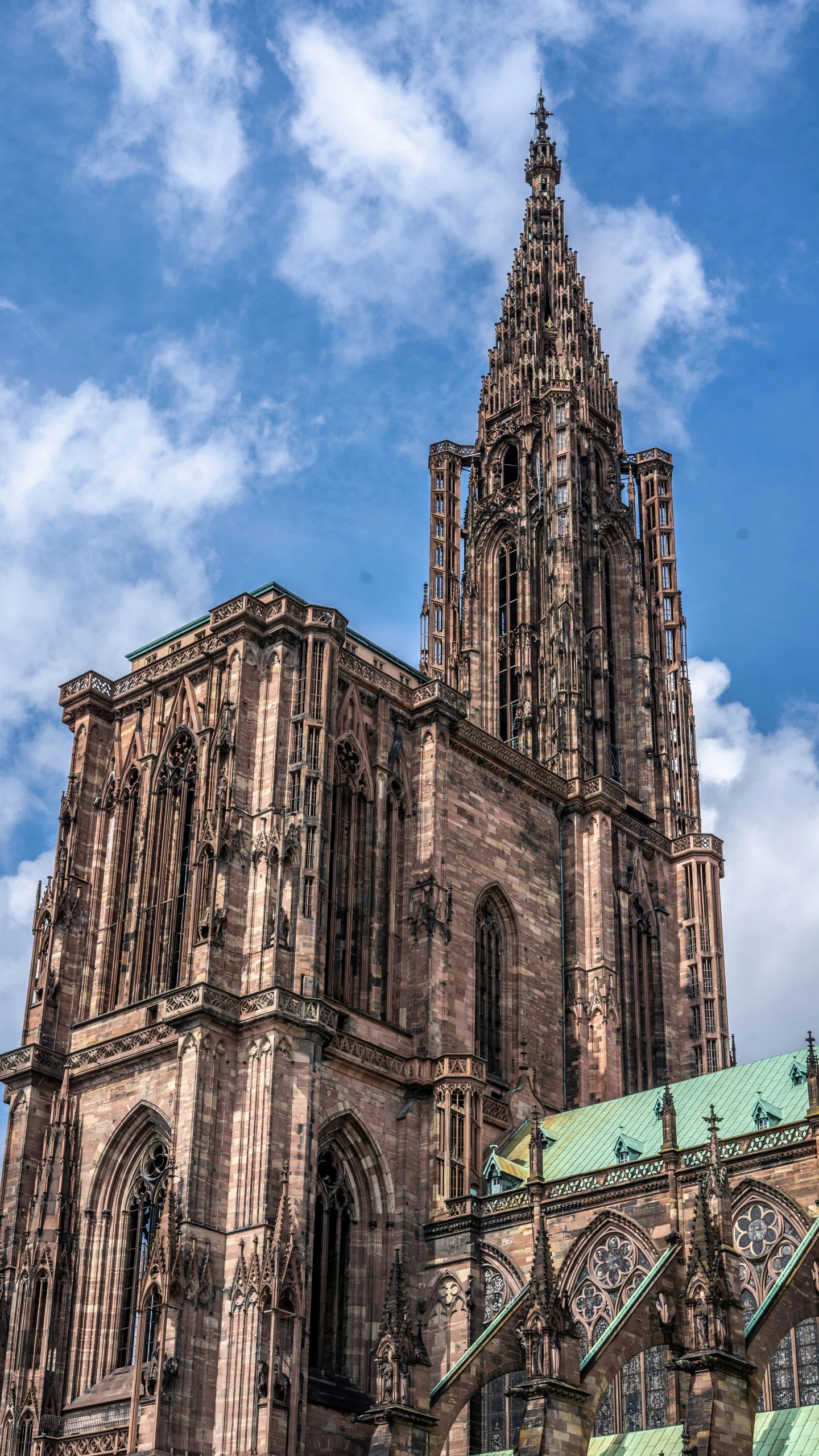 a tall tower building with a clock on the front