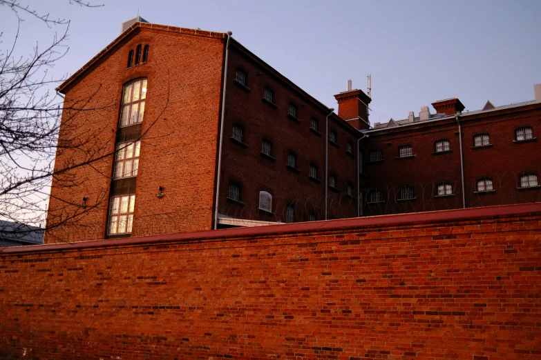 some sort of old building next to a fence