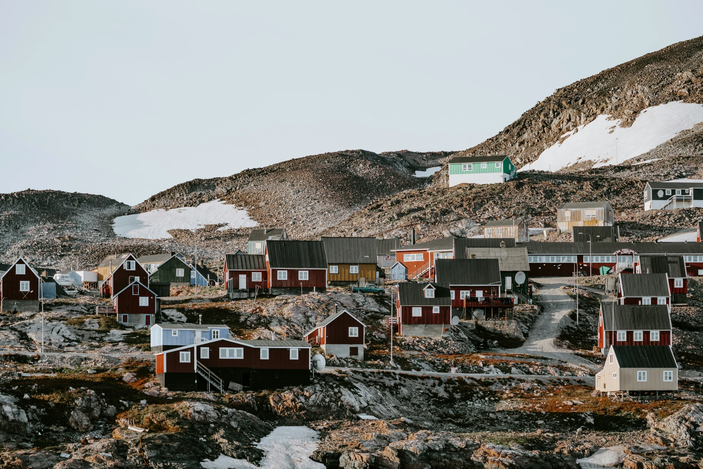 a small village is nestled in a mountain valley