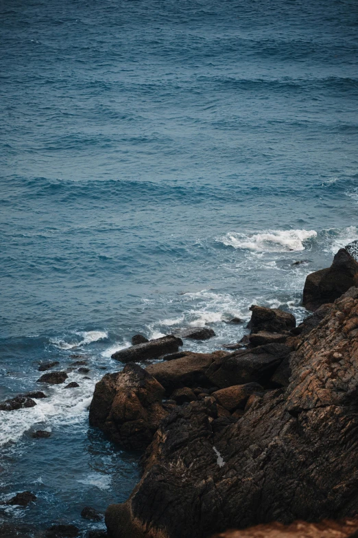 the two men are surfing down the rocks