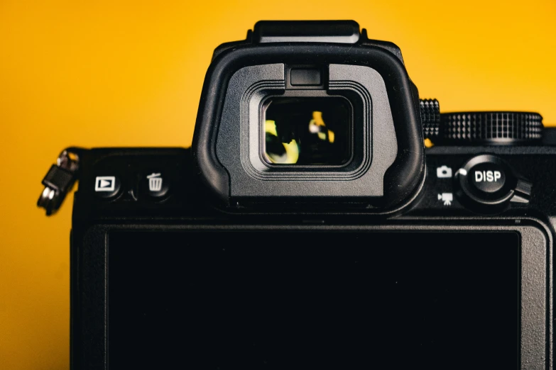 a camera with a flash camera attached to it