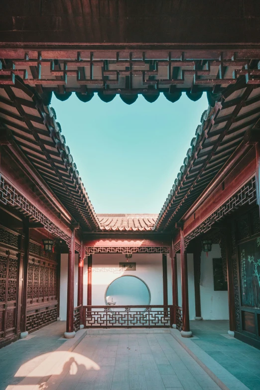 a large courtyard filled with benches and umbrellas