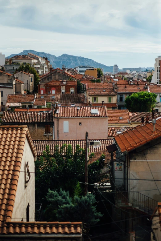 rooftops with rooftops, one of which is tiled and brown