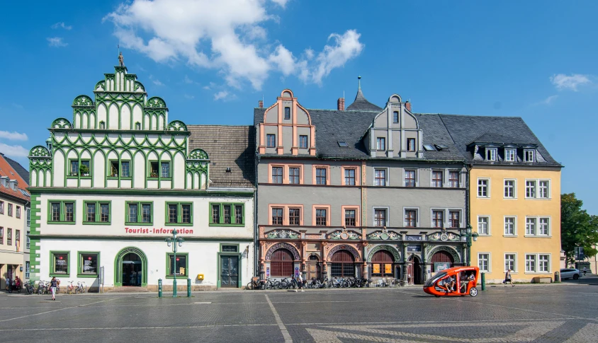 a big square with some buildings and a clock tower