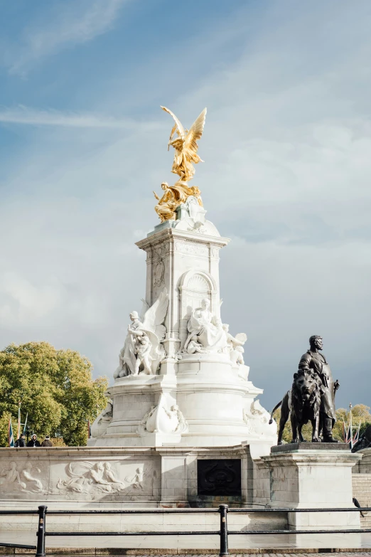 a statue of an angel on a horse and a man