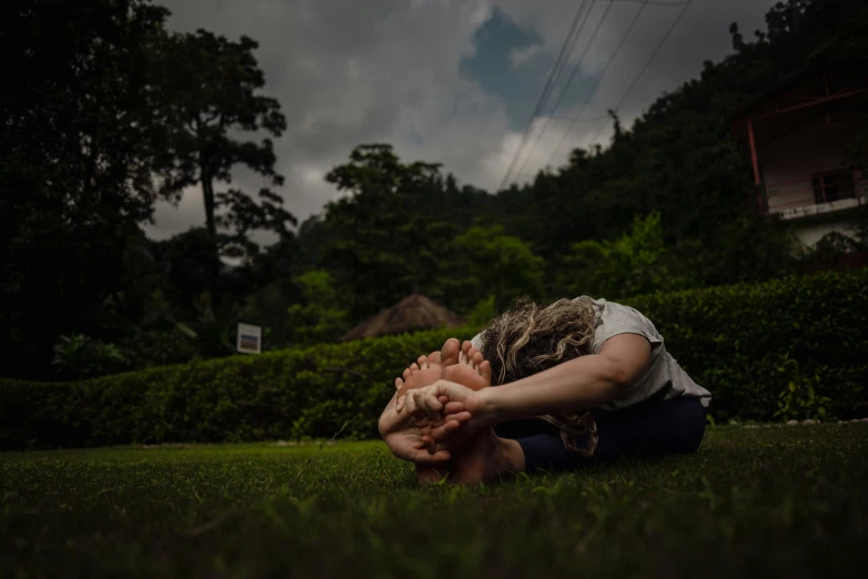a woman laying on the ground with her eyes open