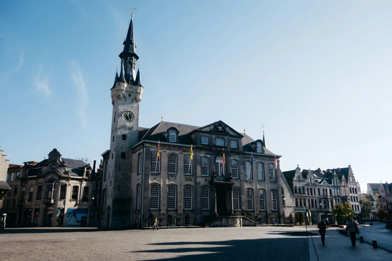 an old building with two towers and a clock