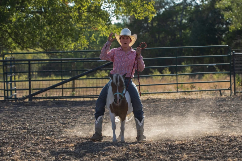 a girl riding on the back of a horse