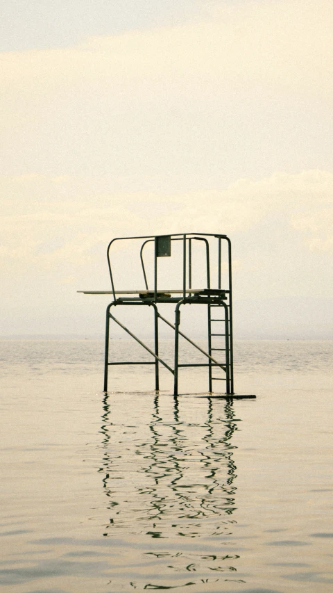 the chairs are stacked high over the water