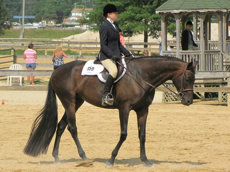 a man riding a horse in an open field