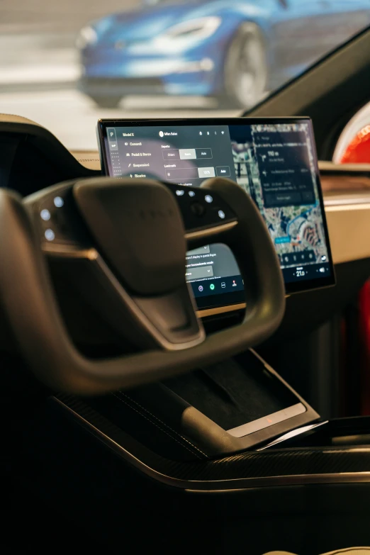 inside the vehicle's console is a macbook on the dashboard