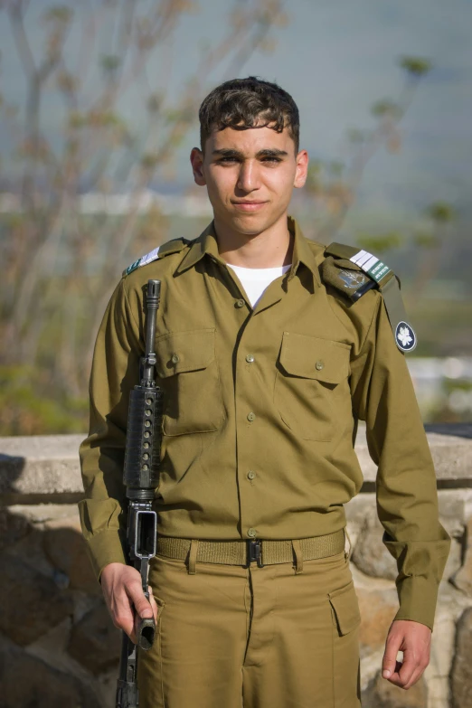 a soldier holding a rifle in his hand