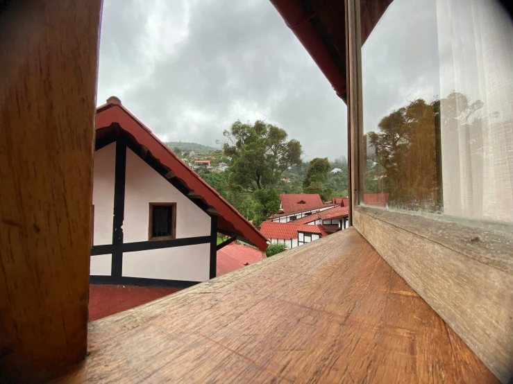 the view out of a window at houses