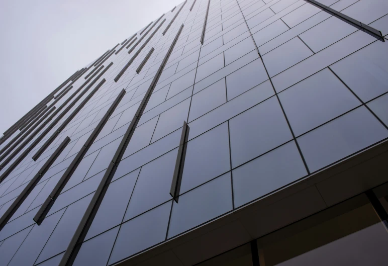 tall glass buildings with a sky in the background