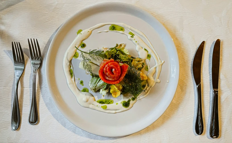 a plate topped with salad and silverware