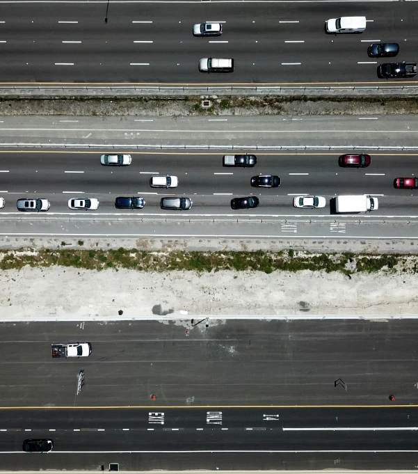 the view from above looking down at cars on a freeway