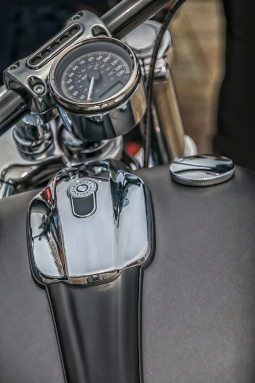 the handle bar of a silver motorcycle