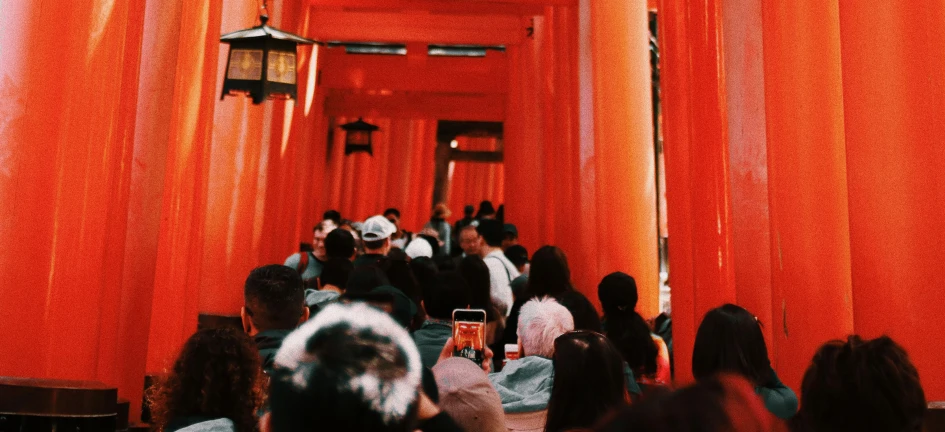 several people standing in an elaborate hall for decoration